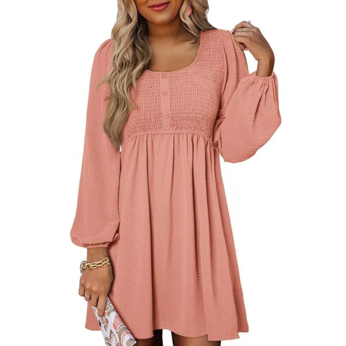 Women's smocked empire waist mini dress with long sleeves and buttons.