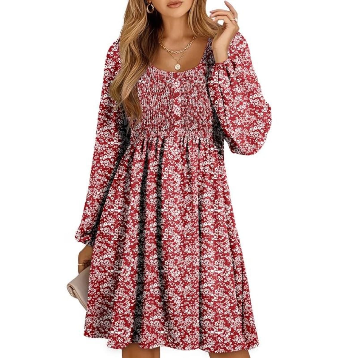 Women's smocked empire waist mini dress with long sleeves and buttons.