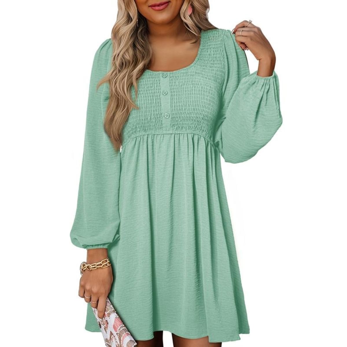 Women's smocked empire waist mini dress with long sleeves and buttons.
