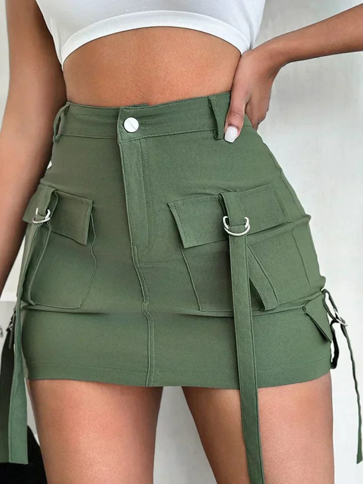 High-waisted cargo mini skirt with patch pockets and adjustable straps.
