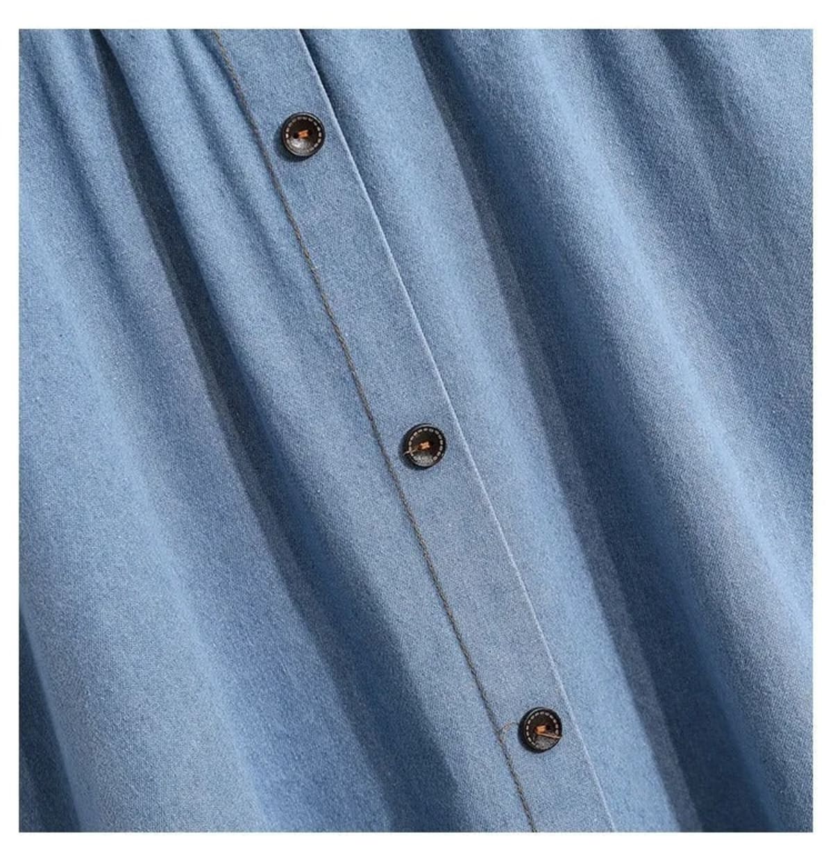 Light blue A-line midi skirt with button-front and elastic waist on hanger.