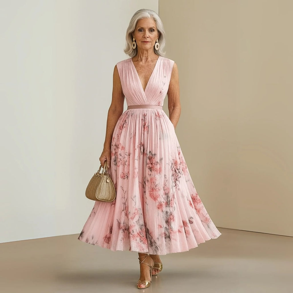 Flowy sleeveless maxi dress with V-neck and soft drape.