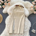 Beige corduroy midi skirt with front slit on white rug.