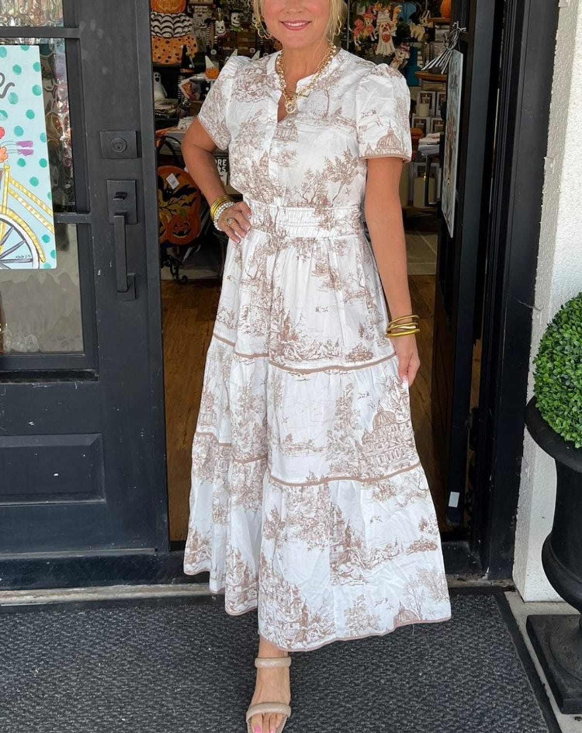 Maxi dress with smocked waist and tiered skirt.