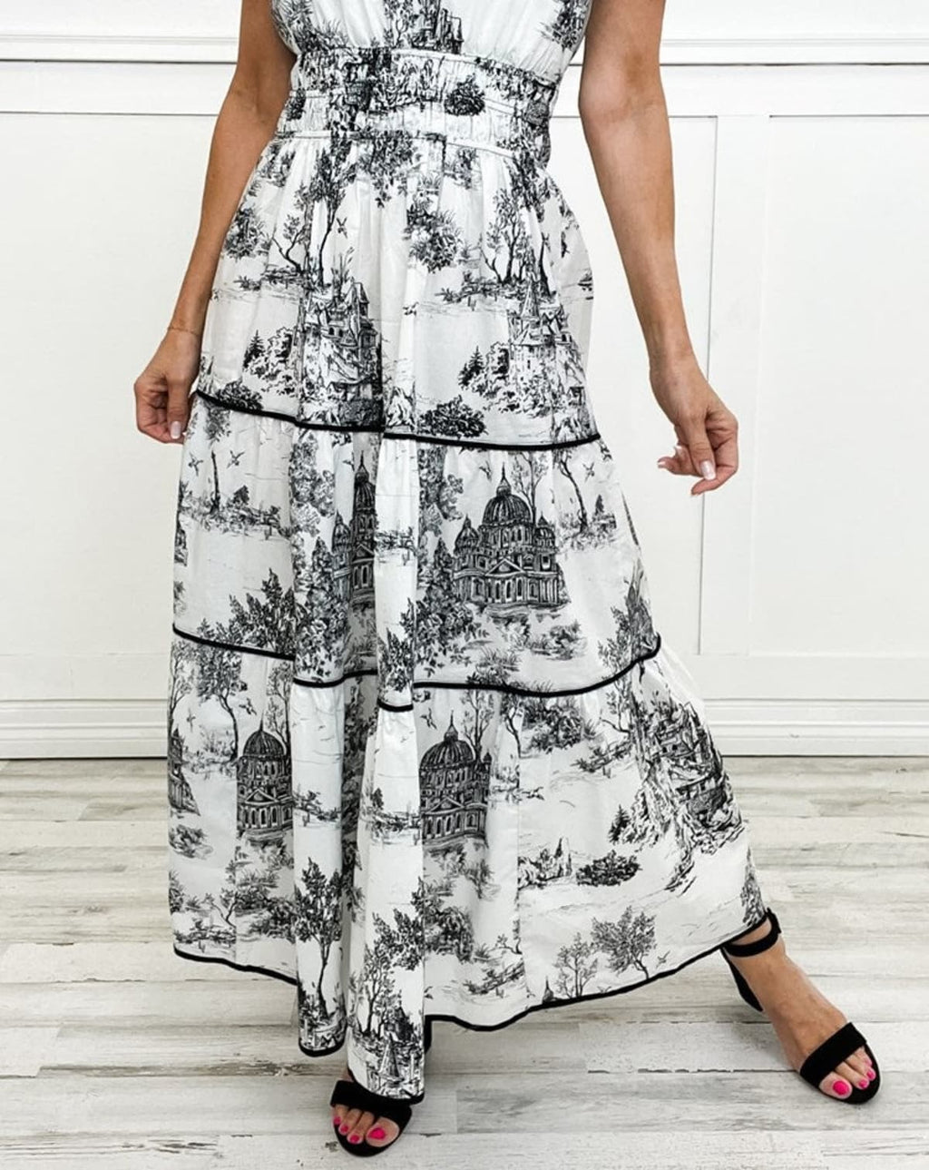 Maxi dress with smocked waist and tiered skirt.