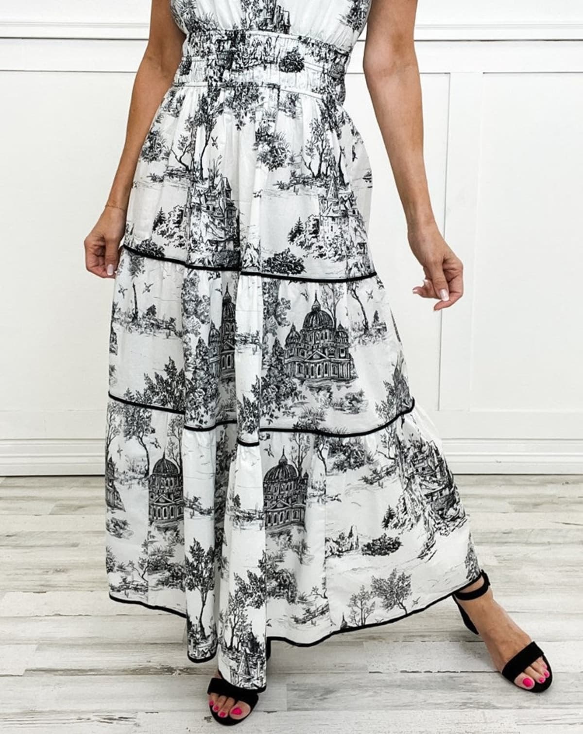 Maxi dress with smocked waist and tiered skirt.