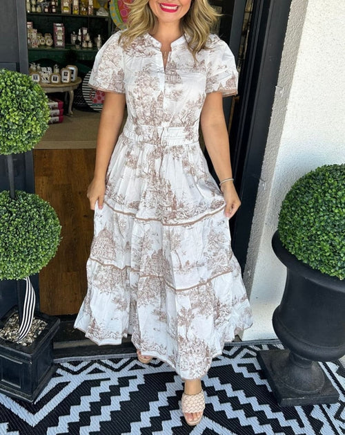 Maxi dress with smocked waist and tiered skirt.
