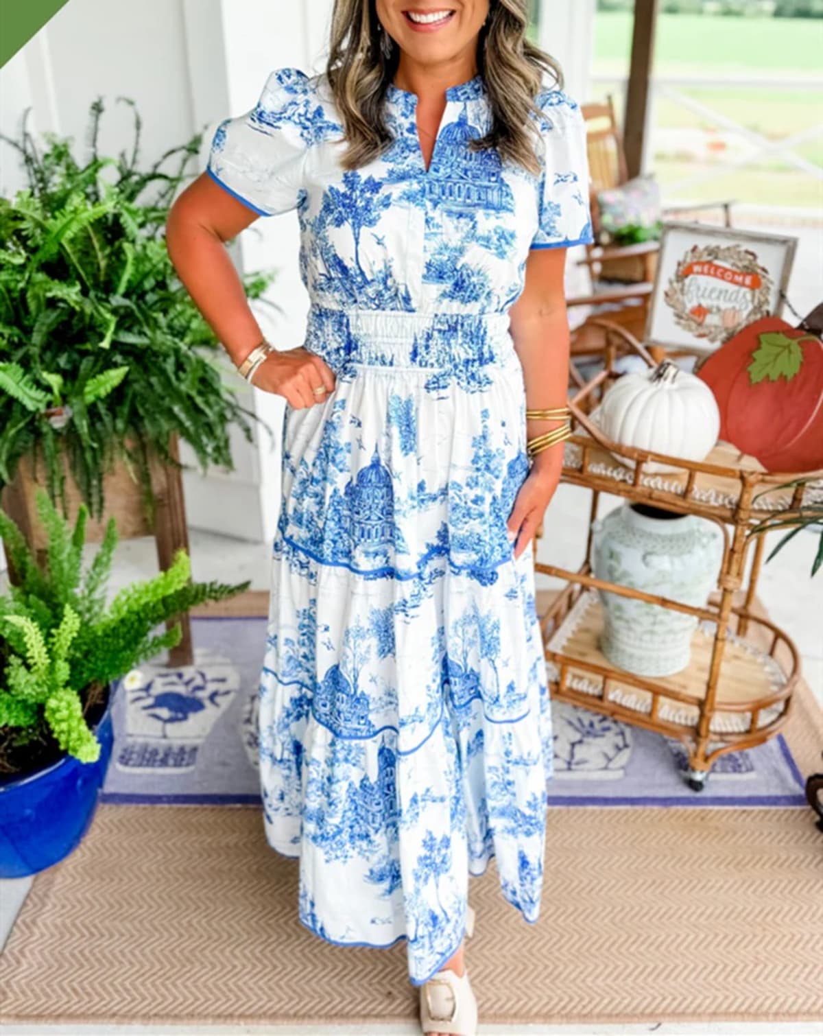 Maxi dress with smocked waist and tiered skirt.