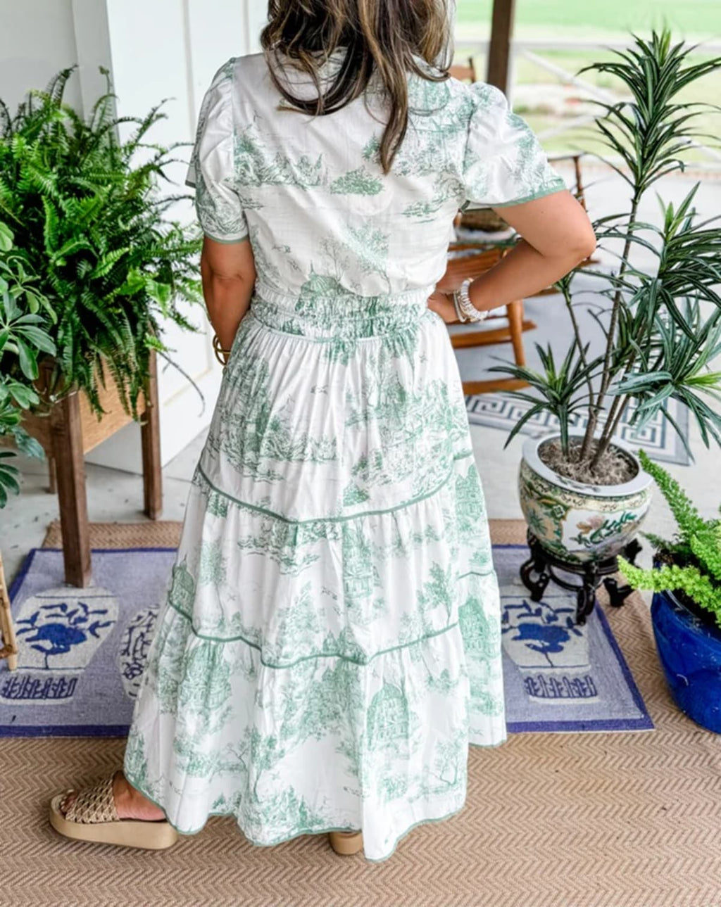 Maxi dress with smocked waist and tiered skirt.
