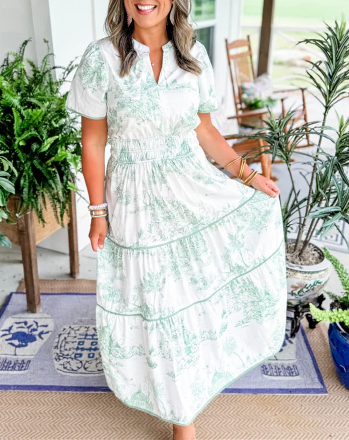 Maxi dress with smocked waist and tiered skirt.