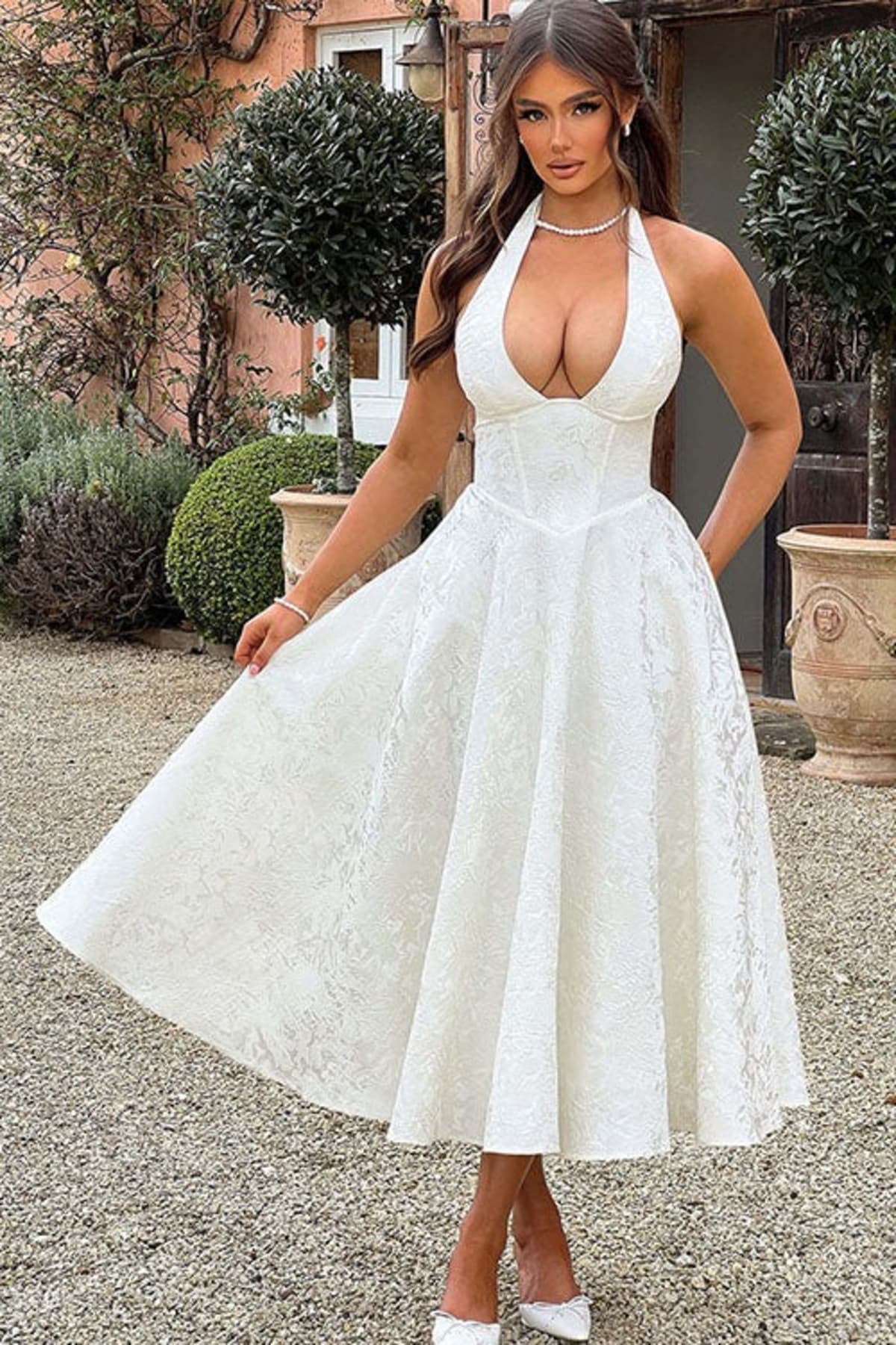 V-neck halterneck jacquard maxi dress with flared skirt.