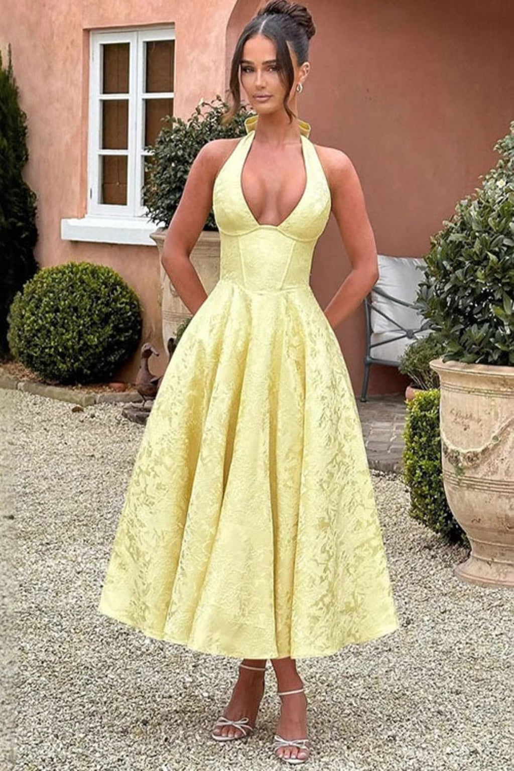 V-neck halterneck jacquard maxi dress with flared skirt.