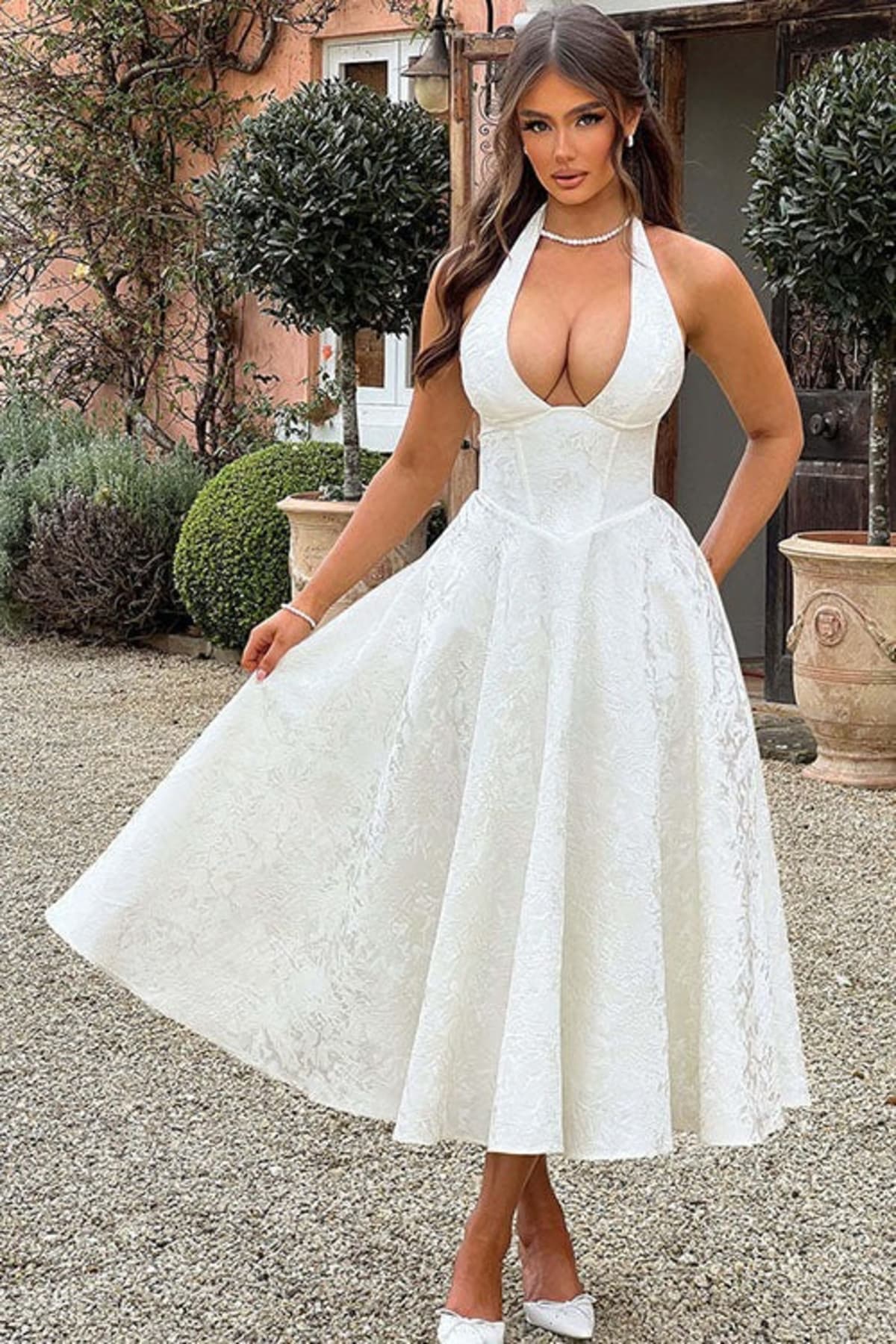 V-neck halterneck jacquard maxi dress with flared skirt.