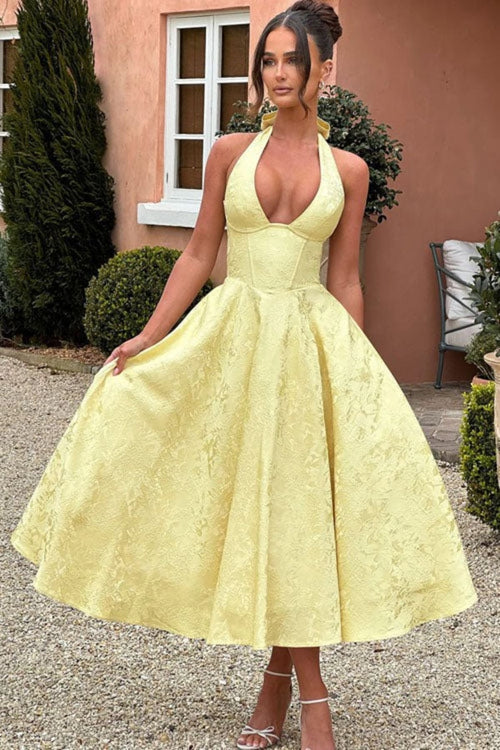 V-neck halterneck jacquard maxi dress with flared skirt.