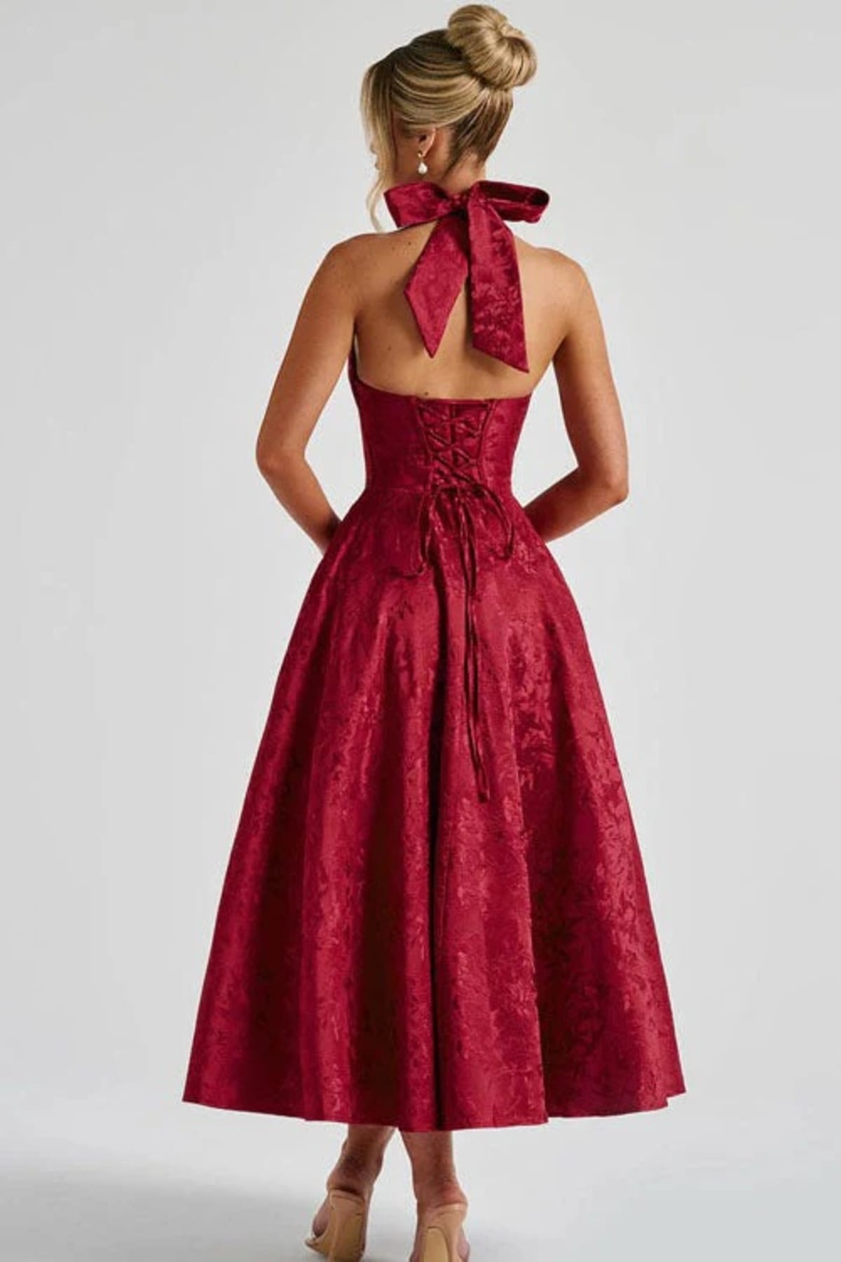 V-neck halterneck jacquard maxi dress with flared skirt.
