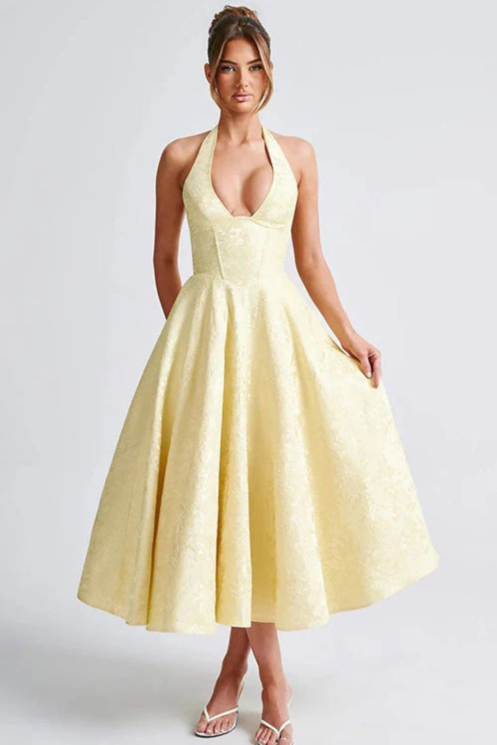 V-neck halterneck jacquard maxi dress with flared skirt.