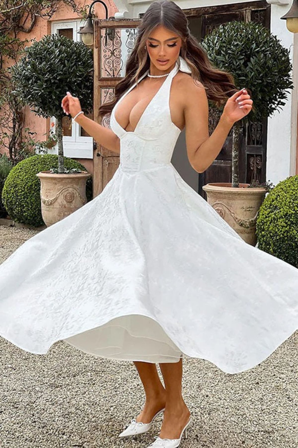 V-neck halterneck jacquard maxi dress with flared skirt.