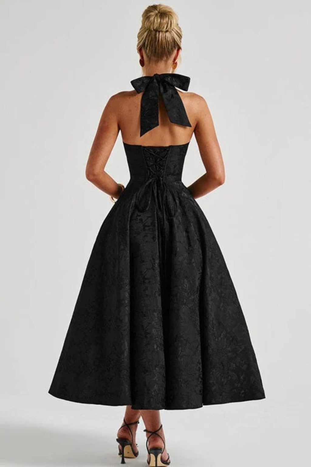 V-neck halterneck jacquard maxi dress with flared skirt.