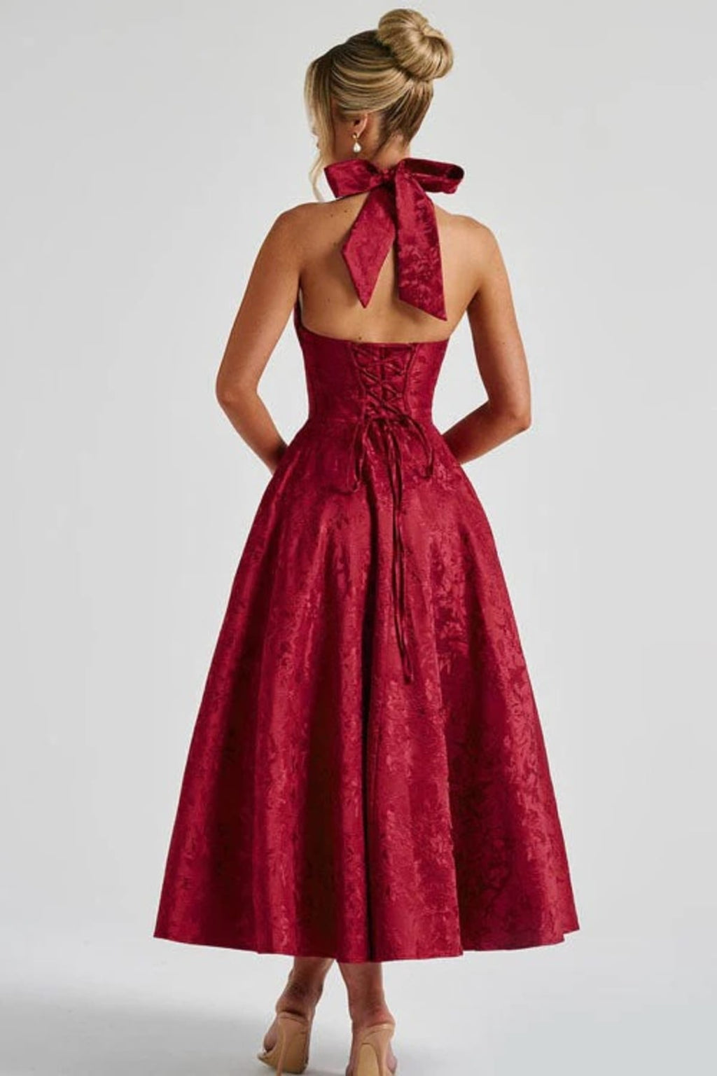 V-neck halterneck jacquard maxi dress with flared skirt.