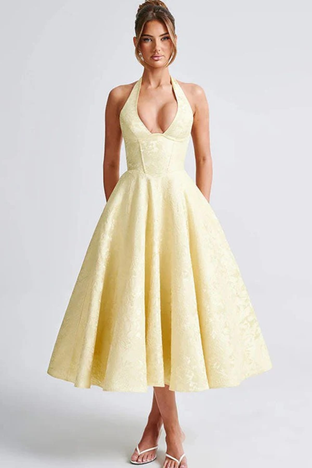 V-neck halterneck jacquard maxi dress with flared skirt.