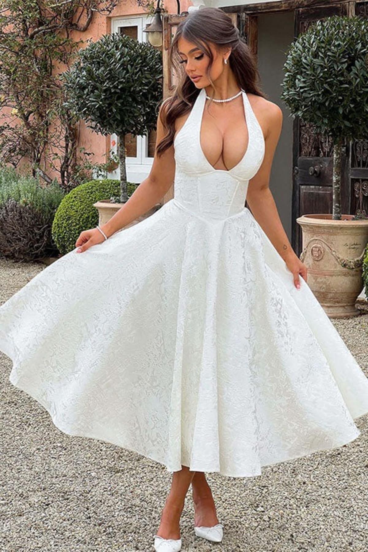 V-neck halterneck jacquard maxi dress with flared skirt.