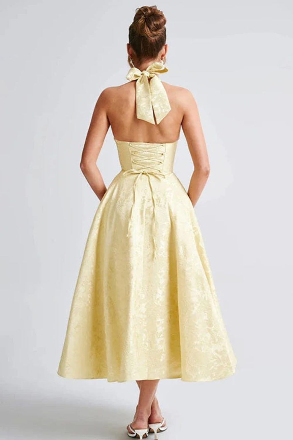 V-neck halterneck jacquard maxi dress with flared skirt.
