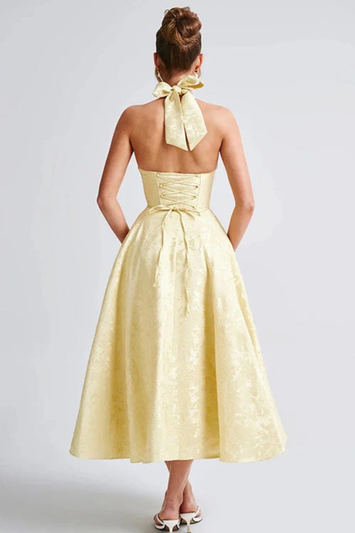 V-neck halterneck jacquard maxi dress with flared skirt.