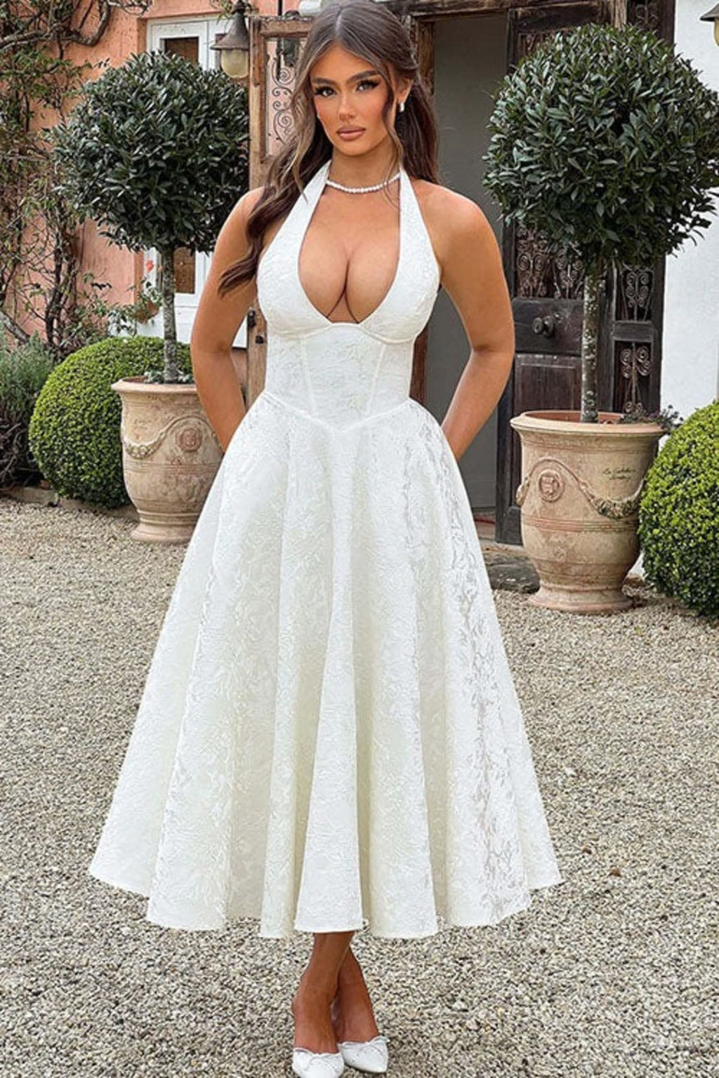 V-neck halterneck jacquard maxi dress with flared skirt.
