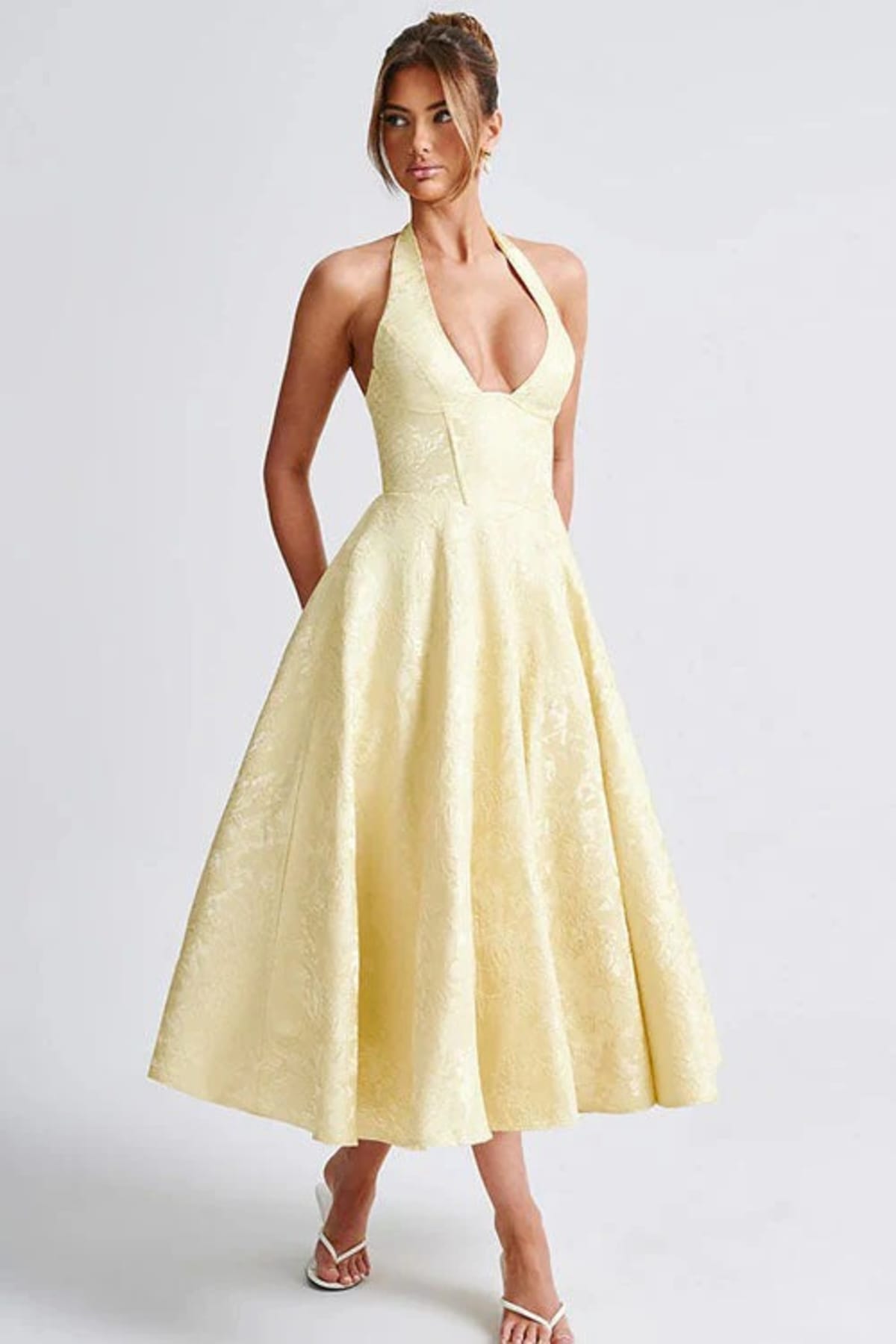 V-neck halterneck jacquard maxi dress with flared skirt.