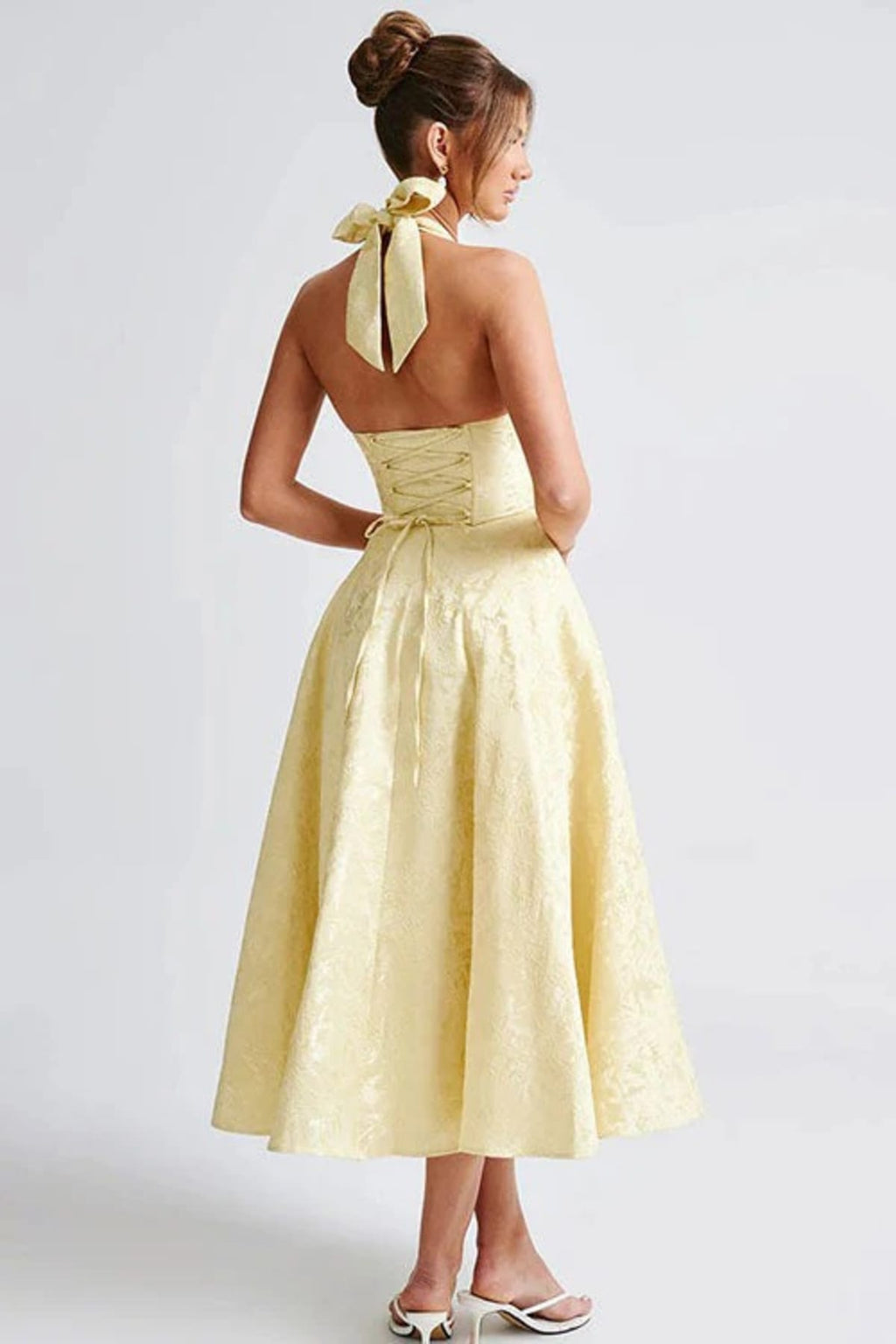 V-neck halterneck jacquard maxi dress with flared skirt.