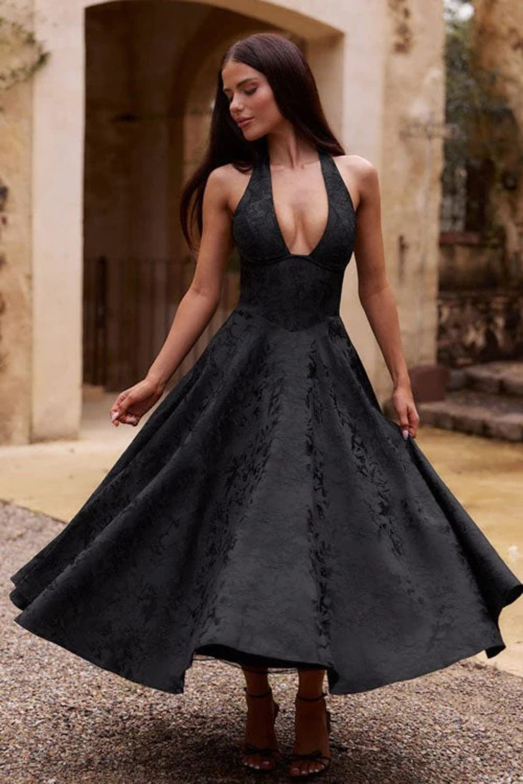 V-neck halterneck jacquard maxi dress with flared skirt.