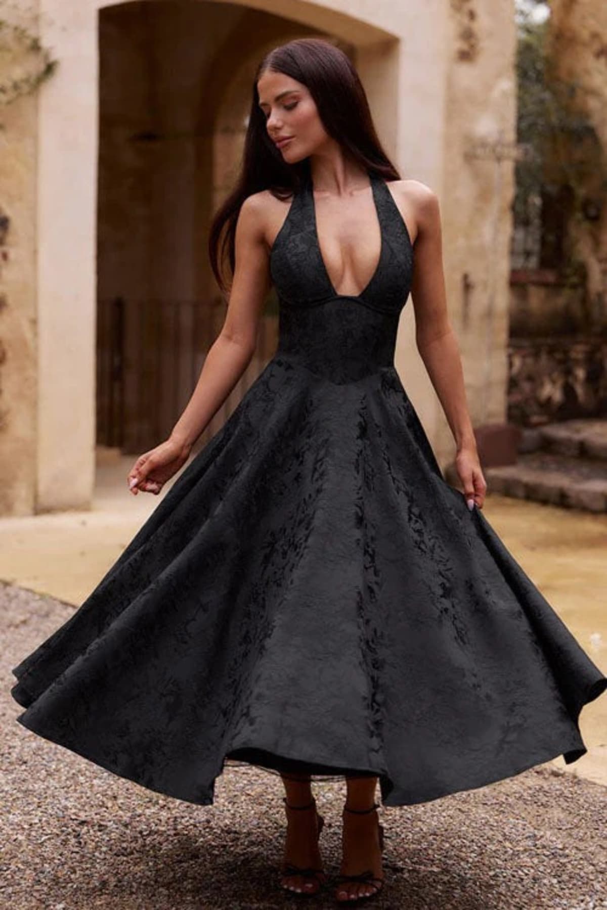 V-neck halterneck jacquard maxi dress with flared skirt.