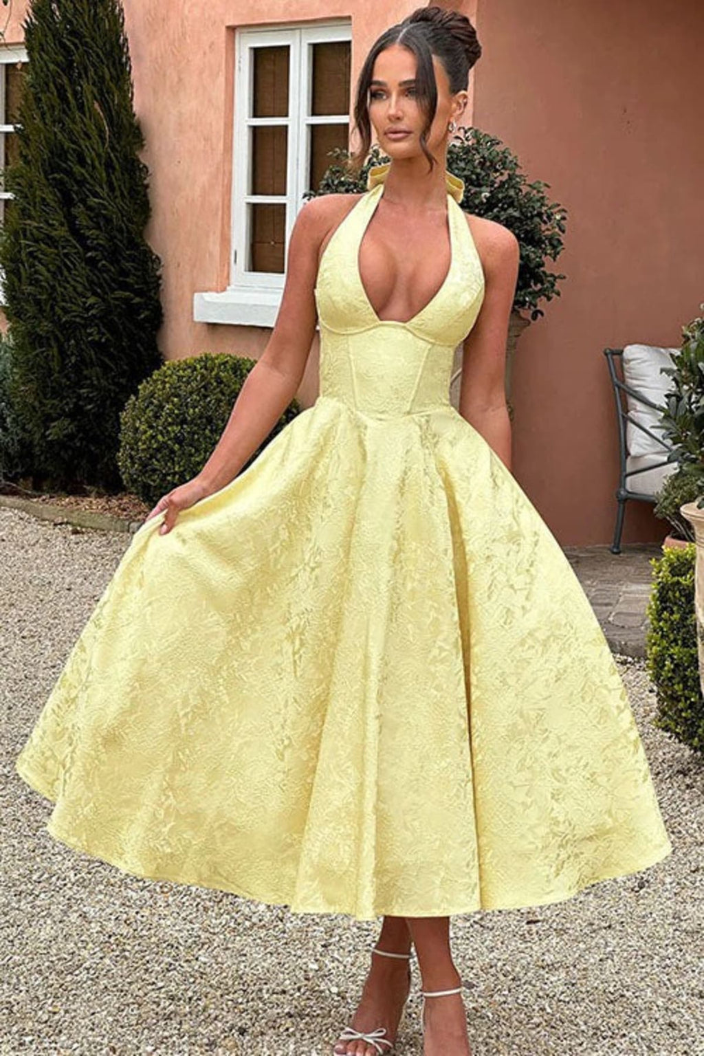 V-neck halterneck jacquard maxi dress with flared skirt.