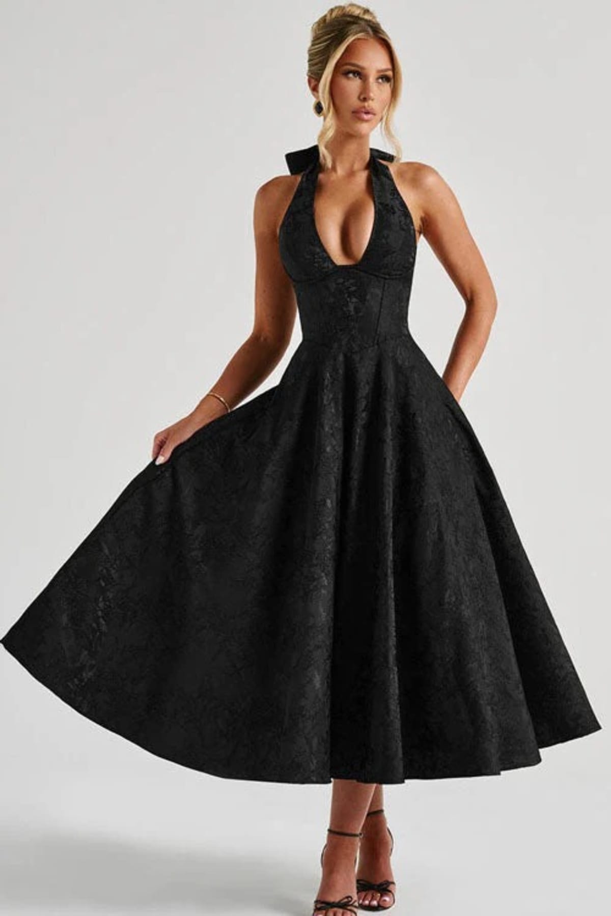 V-neck halterneck jacquard maxi dress with flared skirt.