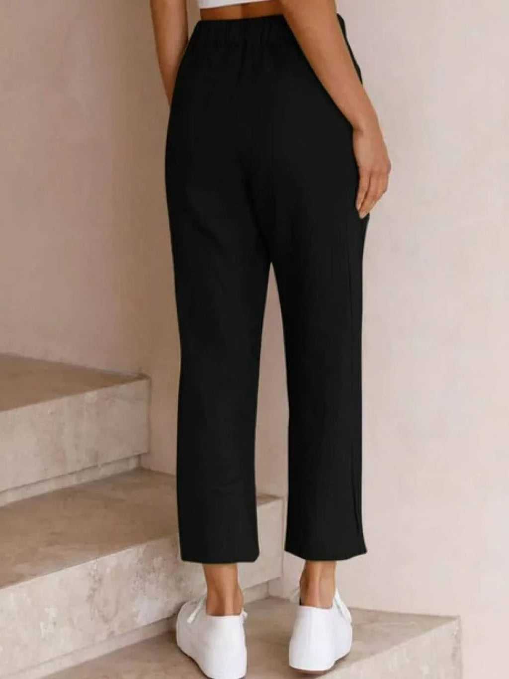 Women's straight-leg pants with drawstring and cuffed hem in a relaxed fit.