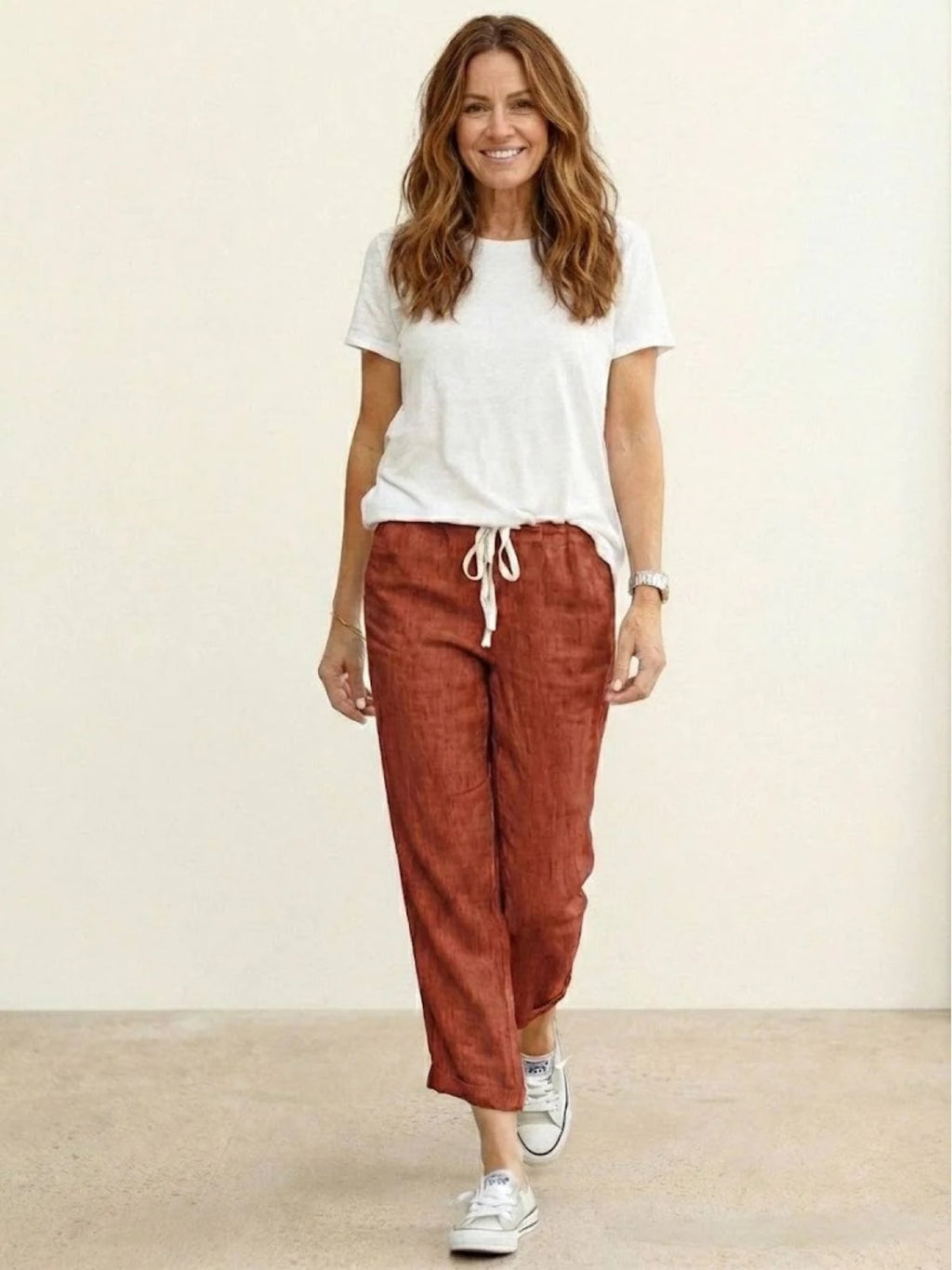 Women's straight-leg pants with drawstring and cuffed hem in a relaxed fit.