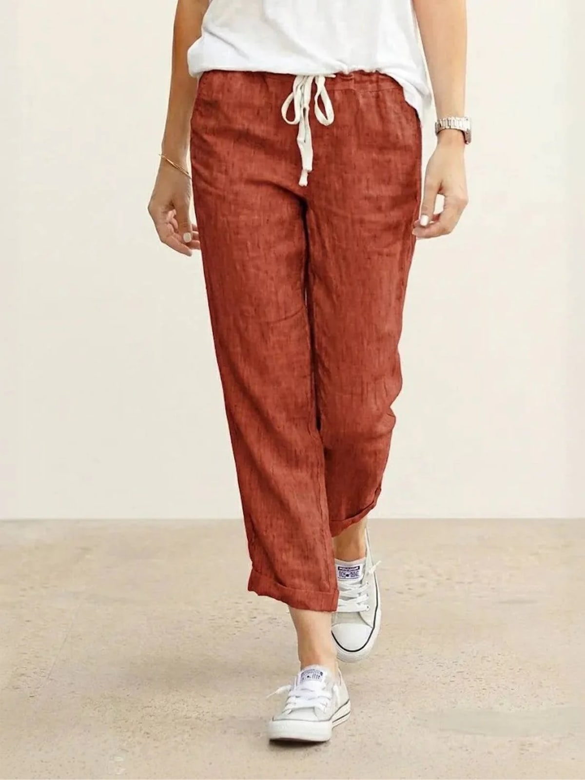Women's straight-leg pants with drawstring and cuffed hem in a relaxed fit.