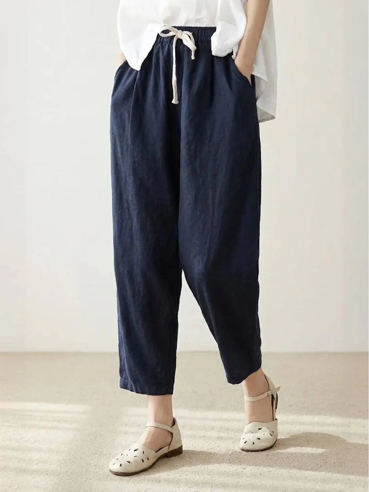 Women's straight-leg pants with drawstring and cuffed hem in a relaxed fit.