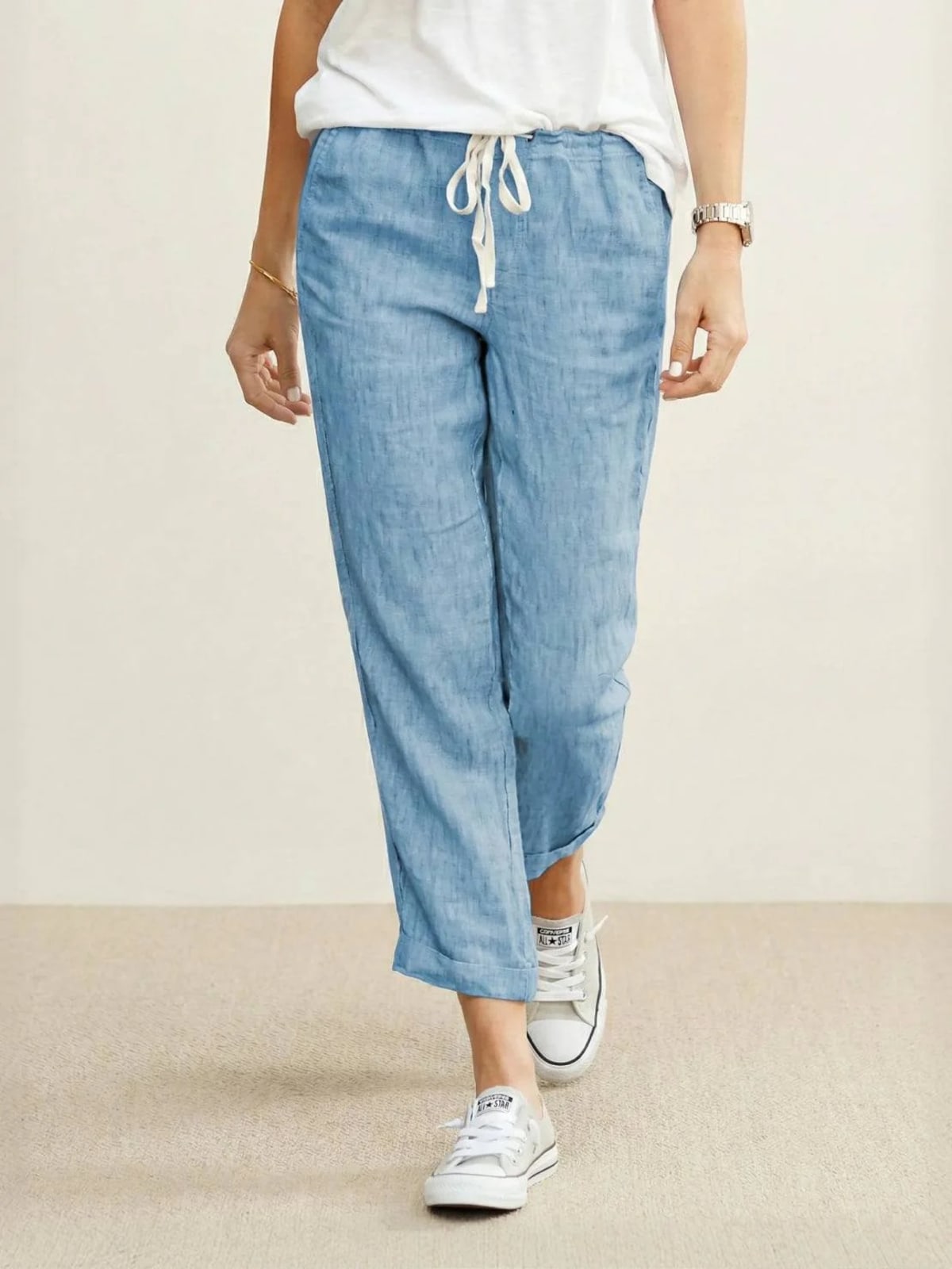 Women's straight-leg pants with drawstring and cuffed hem in a relaxed fit.