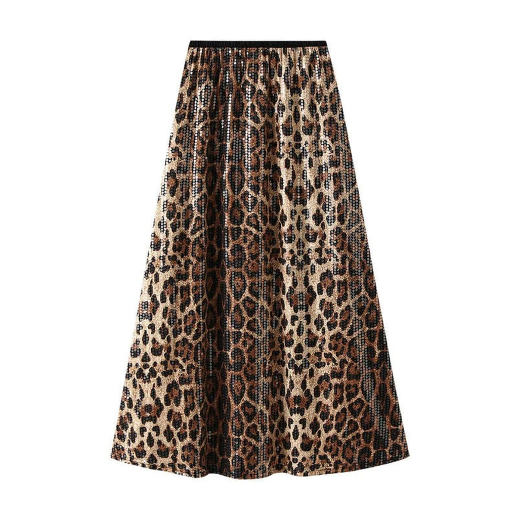Model in leopard print maxi skirt with crossed arms.