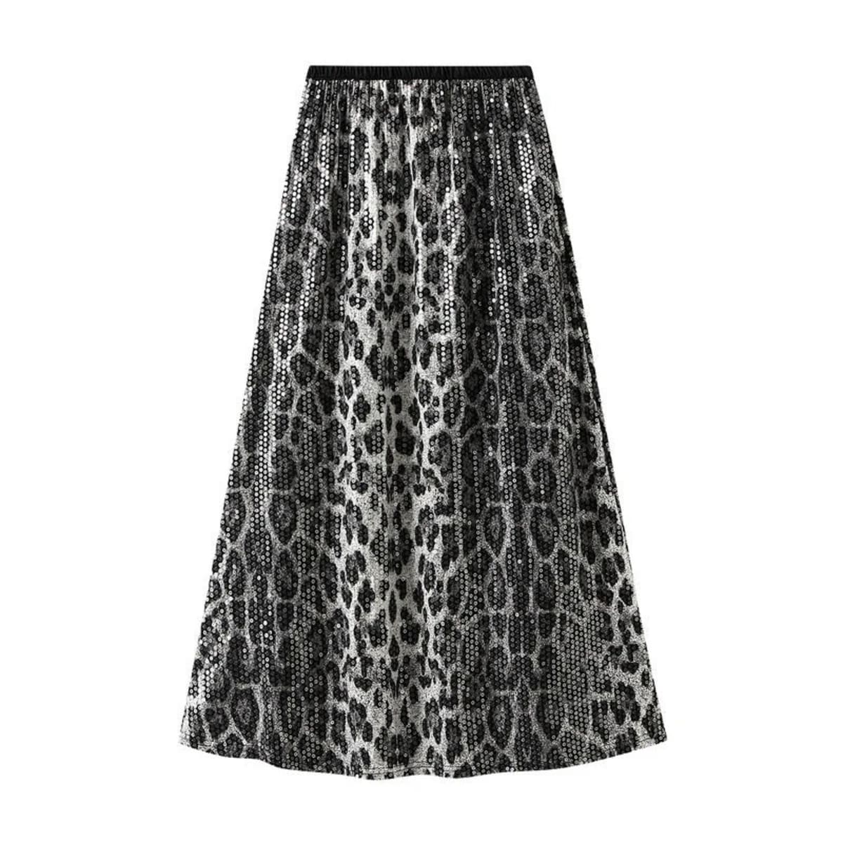 Model in leopard print maxi skirt with crossed arms.