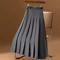 Pleated maxi skirt with belt displayed on a hanger.