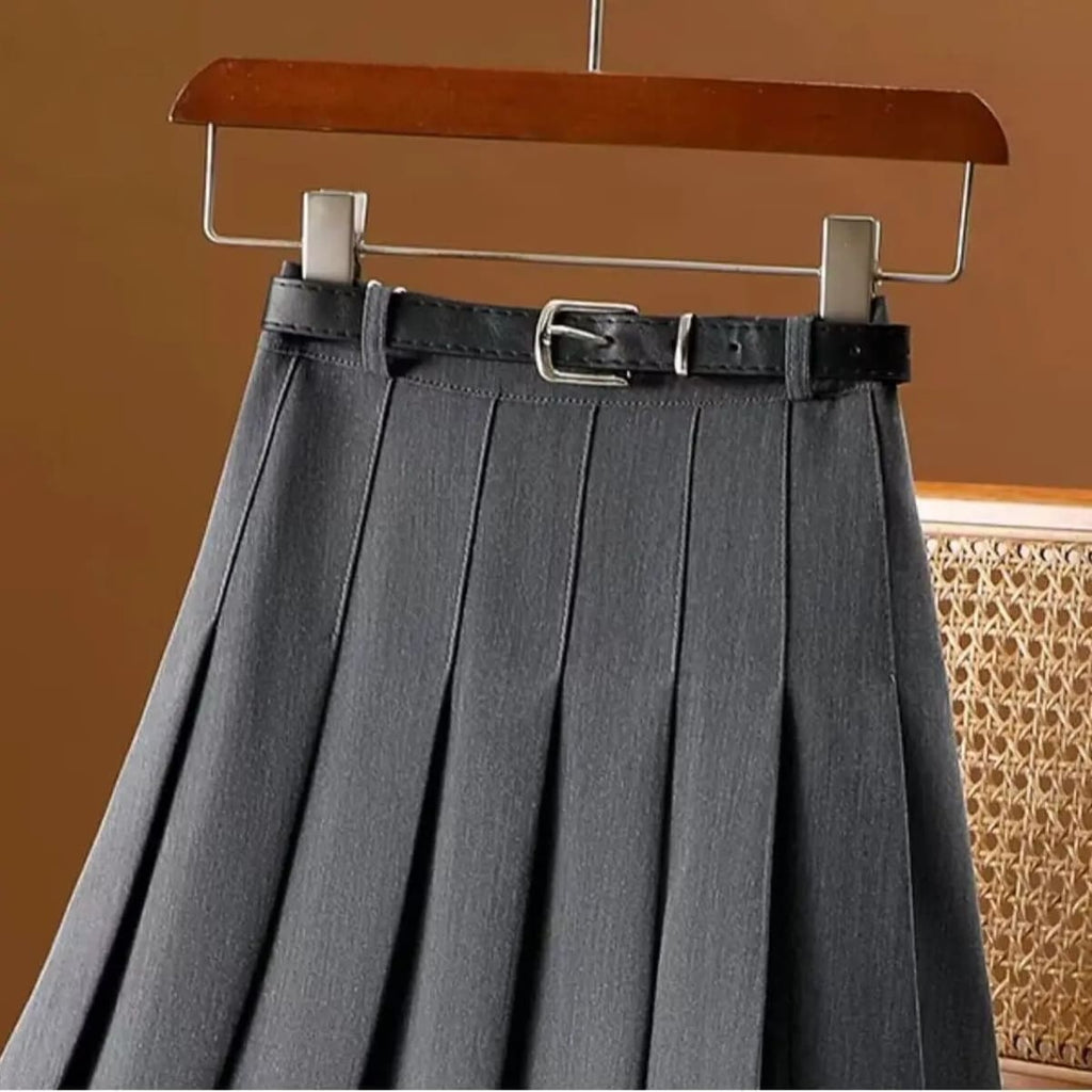 Pleated maxi skirt with belt displayed on a hanger.