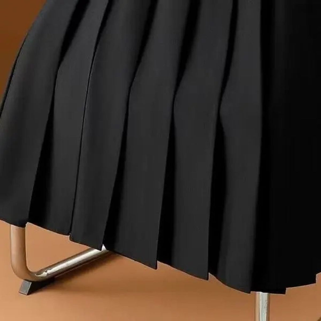 Pleated maxi skirt with belt displayed on a hanger.