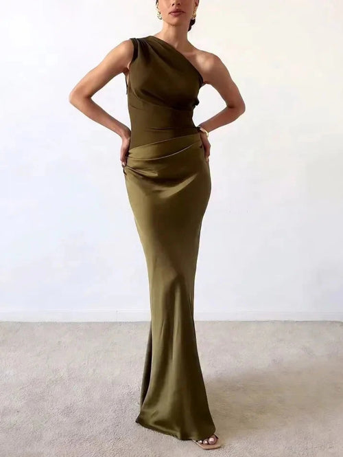 One-shoulder pleated maxi dress with asymmetric neckline.