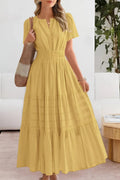 Flowing boho summer dress with delicate patterns and loose fit.