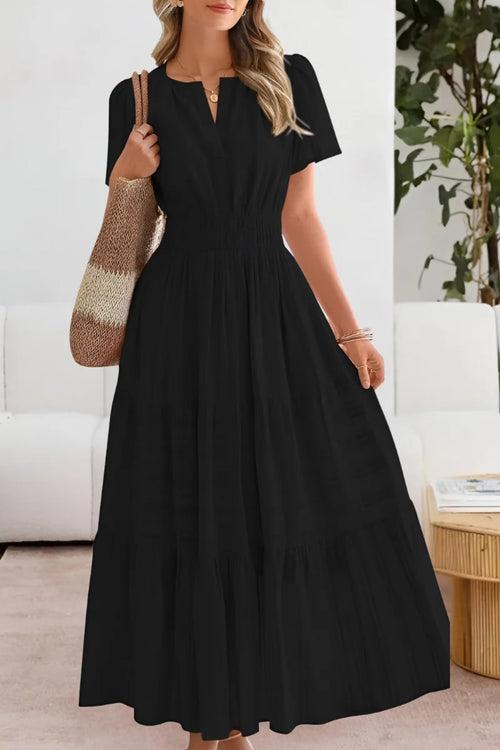 Flowing boho summer dress with delicate patterns and loose fit.