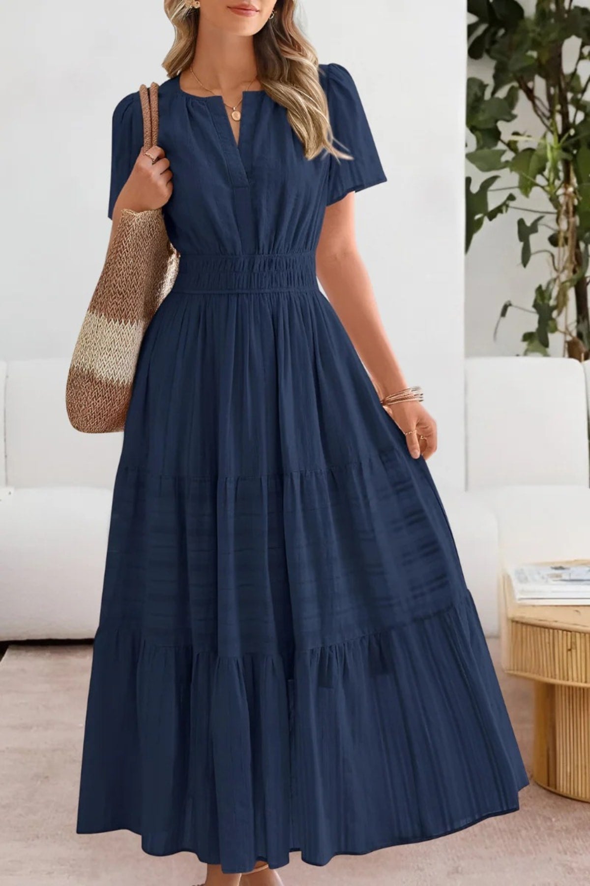 Flowing boho summer dress with delicate patterns and loose fit.