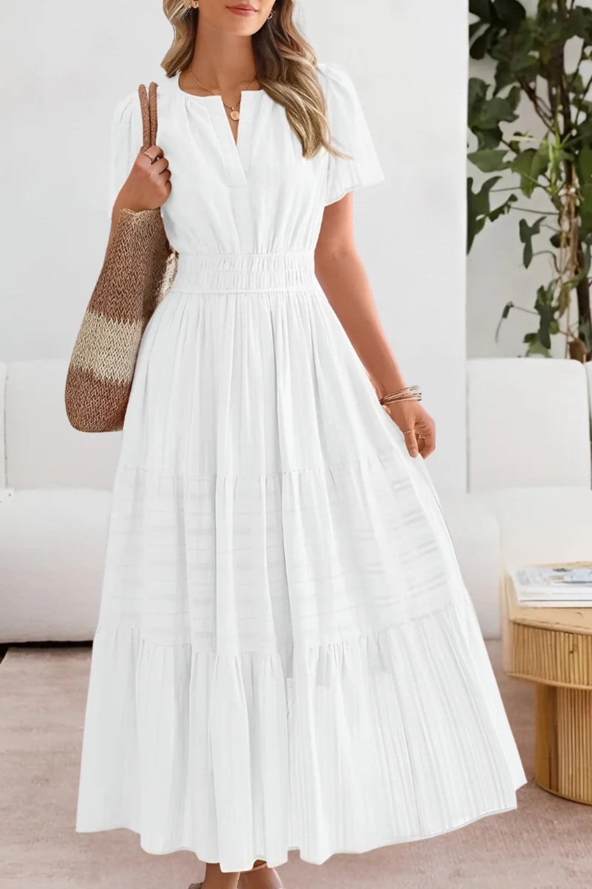 Flowing boho summer dress with delicate patterns and loose fit.