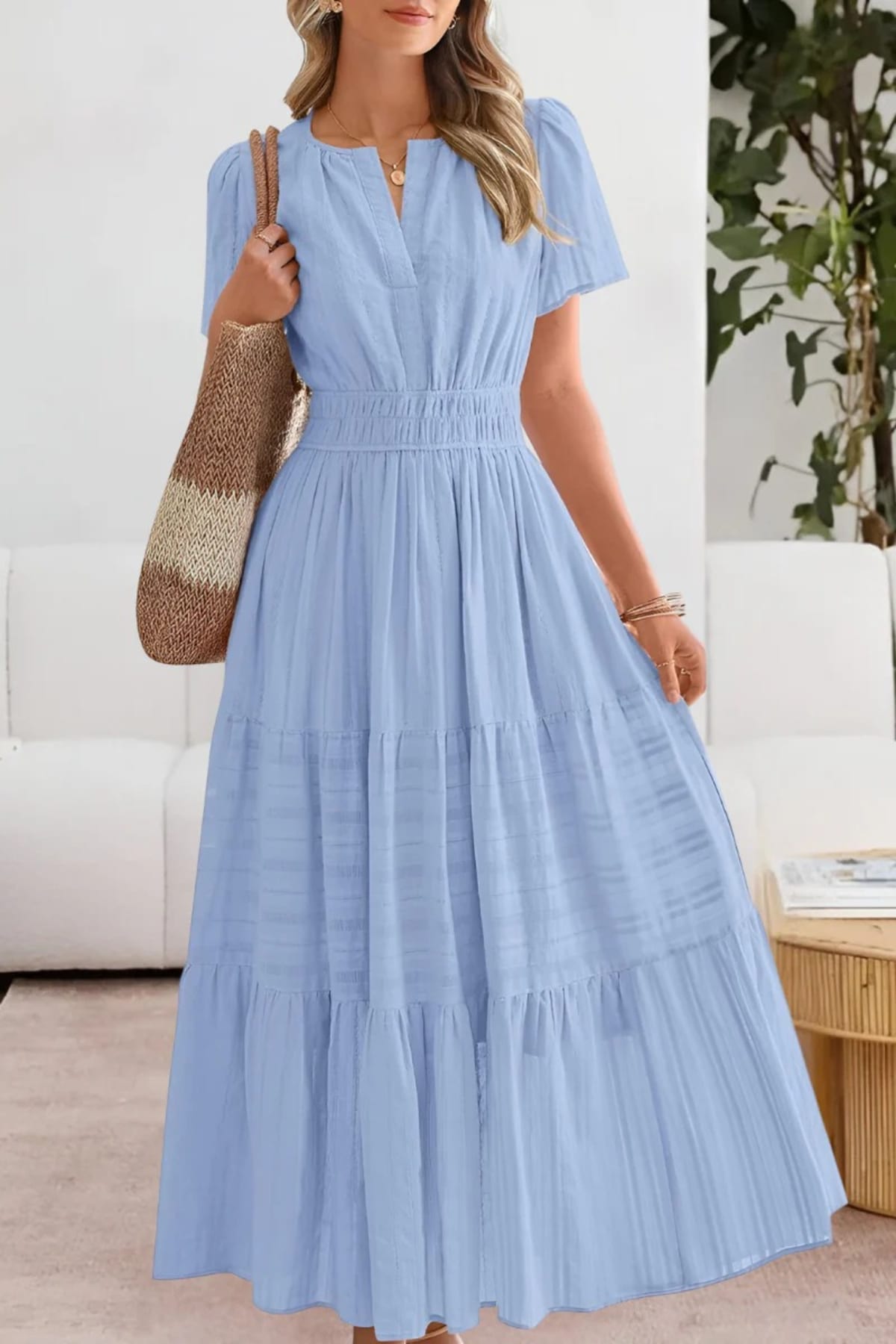 Flowing boho summer dress with delicate patterns and loose fit.